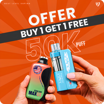 Promotional graphic for Next Level Vaping showing two hands holding vape devices against an orange sunburst background with the text 'OFFER BUY 1 GET 1 FREE 50K PUFF'. One device is black and green with a circular American flag sticker, and the other is bright blue with a clear tank and metallic top.